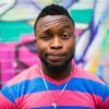 Photo by Ayo Ogunseinde black haired man making face